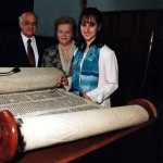 Jacob and Hildegard Hennenberg with their first granddaughter Julie Hennenberg at her Bat Mitzvah. The pictured scroll survived the Holocaust in Czechoslovakia and was ultimately brought back to the United States from England by Mr. Rosenthal.